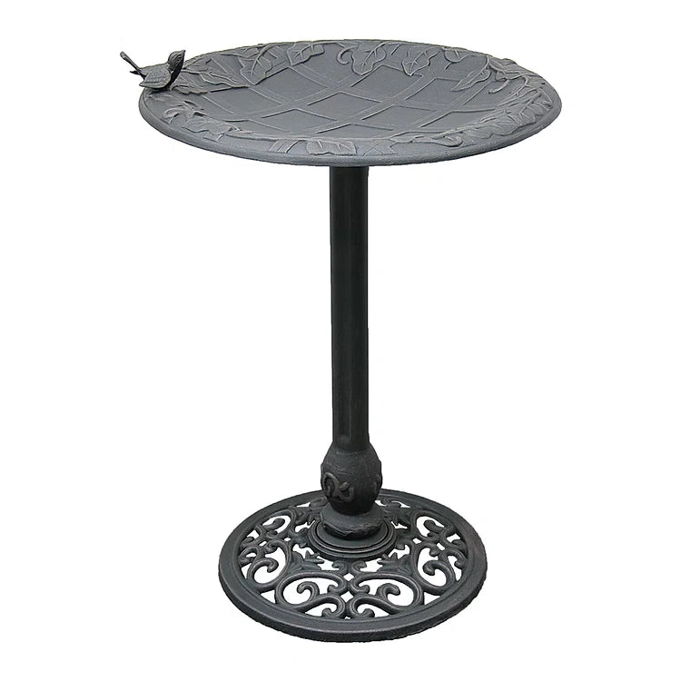 English Ivy Birdbath, Copper Rust: Cast-iron birdbath with leaf-patterned basin, bird accent, slender stem, and scroll-work base, offering elegance and stability for garden birds.