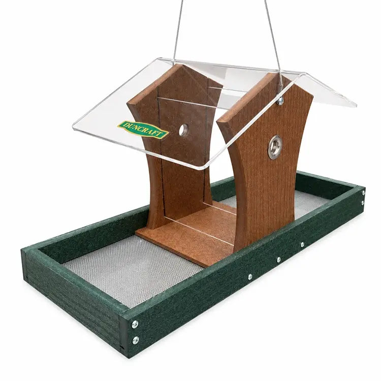Hopper bird feeder with green platform base on a white background