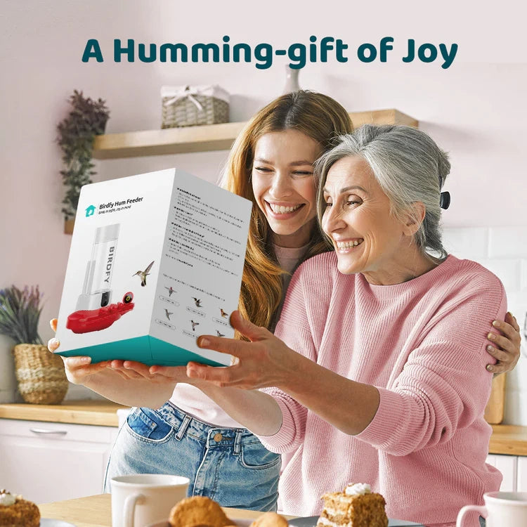 Two women looking at a product together with text 'A Humming-gift of Joy' above them.