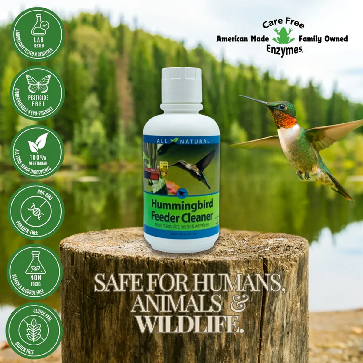 Hummingbird Feeder Cleaner, 16 oz. bottle on a stump, with eco-friendly icons; inspected by a hovering hummingbird.