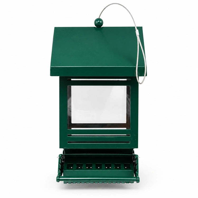 Front view of green metal bird feeder with clear viewing window, feeding tray, and steel hanging cable on a white background.