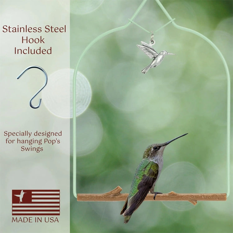 Hummingbird ornament with stainless steel hook on a blurred green background