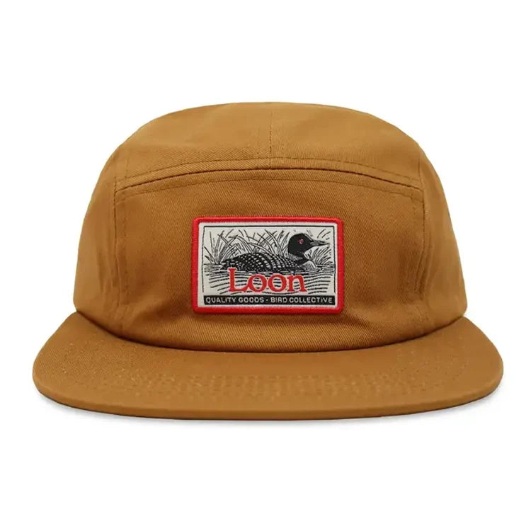 Five-panel corduroy hat with a loon patch, labeled Loon Quality Goods – Bird Collective, offering adventure-ready style for outdoor enthusiasts.