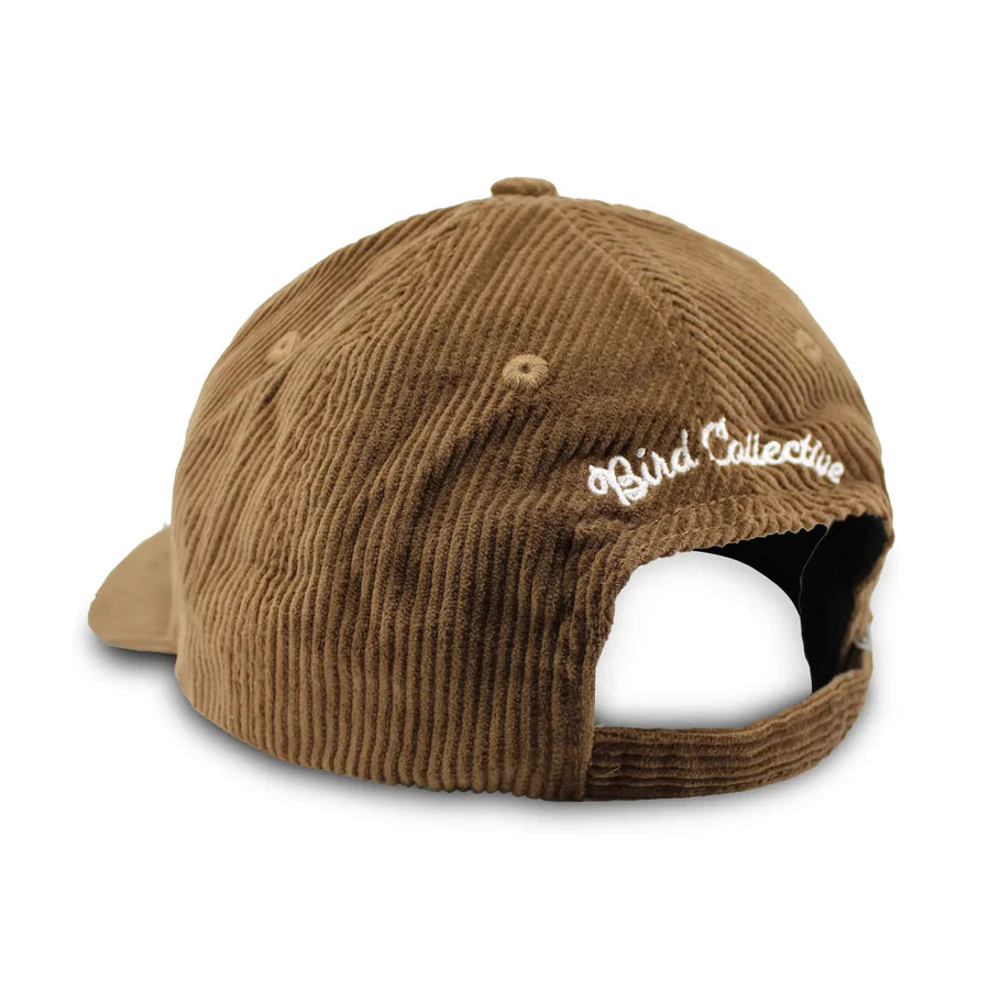 Eastern Bluebird Corduroy Hat, Chestnut, viewed from the back, features an adjustable strap and Bird Collective embroidery, crafted in sophisticated brown corduroy.