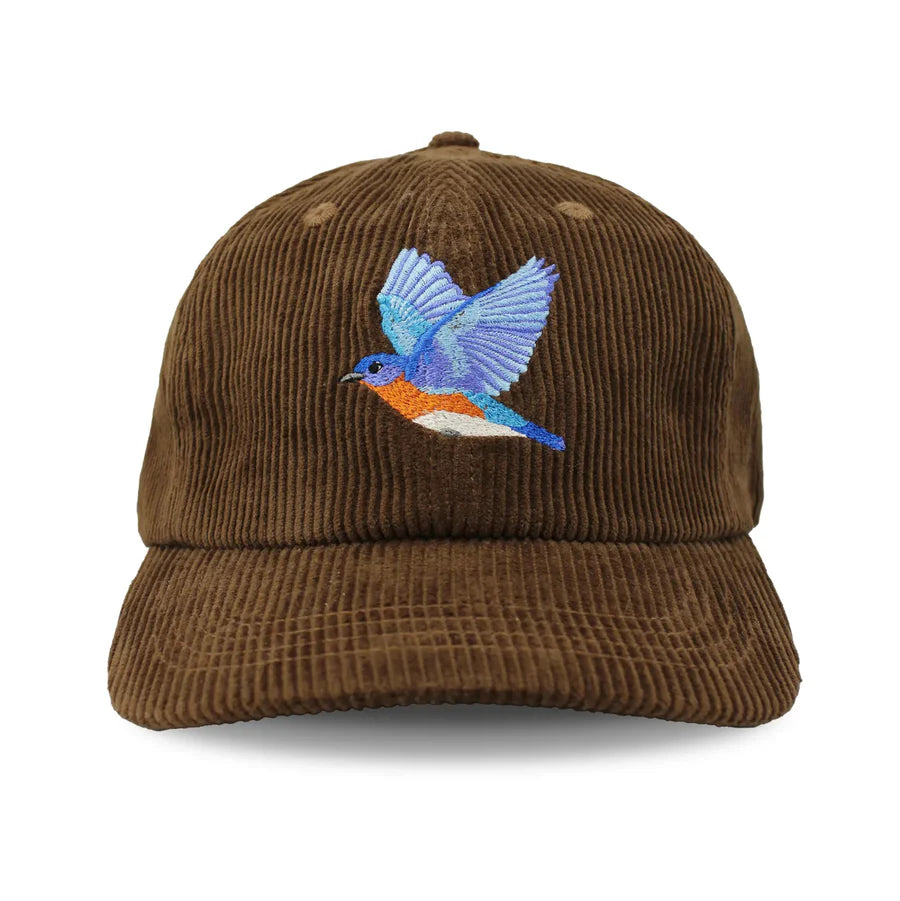 Eastern Bluebird Corduroy Hat, Chestnut: Brown corduroy baseball cap with an embroidered blue-winged, orange-bellied bird, adjustable metal clasp, perfect for birdwatching enthusiasts.