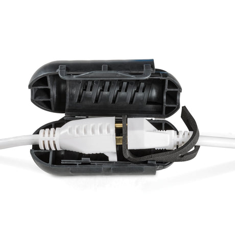 ClickShield™ Cord Lock showcases two connected power-cord ends encased in a black, gasket-sealed housing, ensuring waterproof protection for heated birdbath connections.