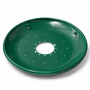 Green metal seed tray with a shallow bowl shape, central mounting hole, and multiple drainage holes, shown on a white background.