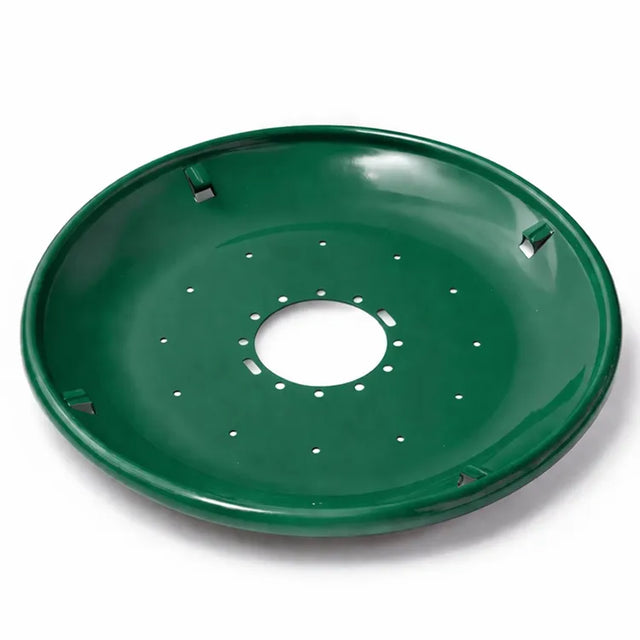 Green metal seed tray with a shallow bowl shape, central mounting hole, and multiple drainage holes, shown on a white background.