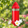 Crystal Lantern hummingbird feeder with clear glass nectar reservoir, decorative red top and base, and three flower feeding ports.