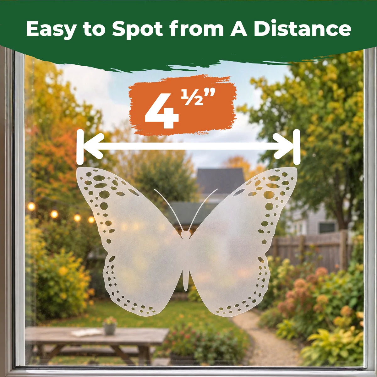 Translucent 4.5-inch butterfly window decal applied to glass with a backyard visible outside.