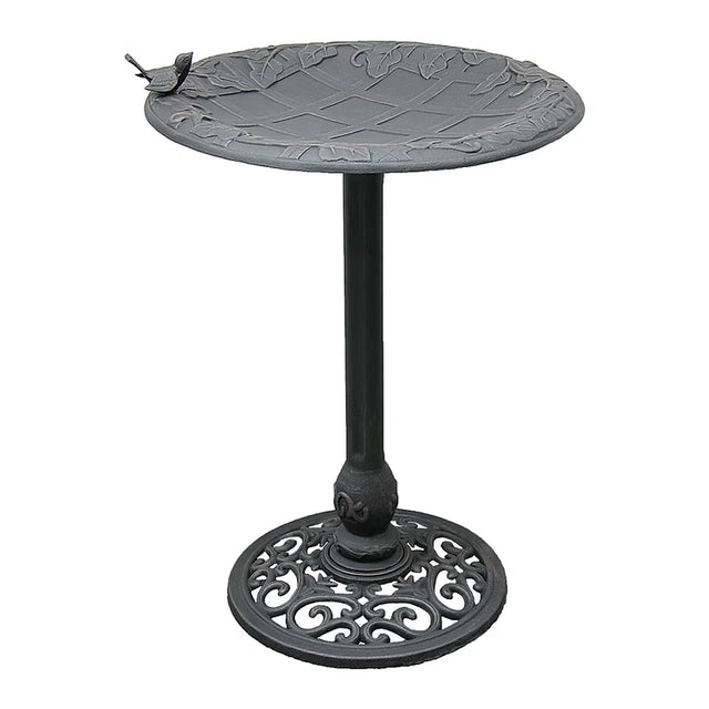 English Ivy Birdbath, Copper Rust: Cast-iron birdbath with leaf-patterned basin, bird accent, slender stem, and scroll-work base, offering elegance and stability for garden birds.