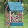 Duncraft Hanging Seed Block Feeder with birds perched on it, showcasing its spacious perching area and sturdy construction ideal for outdoor feeding.
