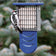Duncraft Bird-Safe® Tail Prop Suet Feeder with blue tail support, holds a suet cake, features wire grid for clinging, and supports woodpecker feeding.