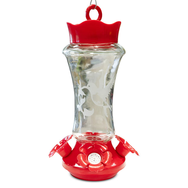 Etched Glass Hummingbird Feeder with clear reservoir, frosted hummingbird motif, red cap and base, three flower-shaped ports, metal hanger, and built-in ant moat.