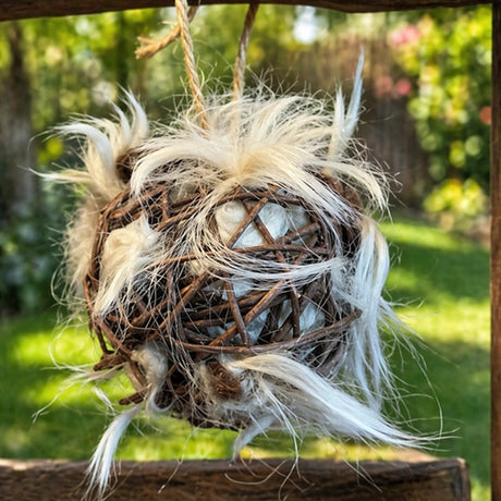 Alpaca Ball Nester with a grapevine ball filled with alpaca wool, ideal for bird nesting, offering warmth and quick-drying properties.