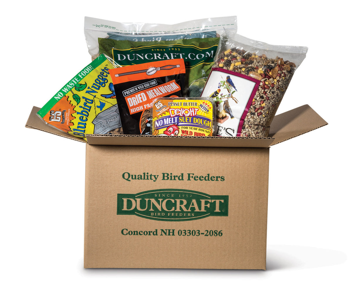 Duncraft Brown Box with bird seed and suet cakes for the birds.  Autoship Deliveries. 