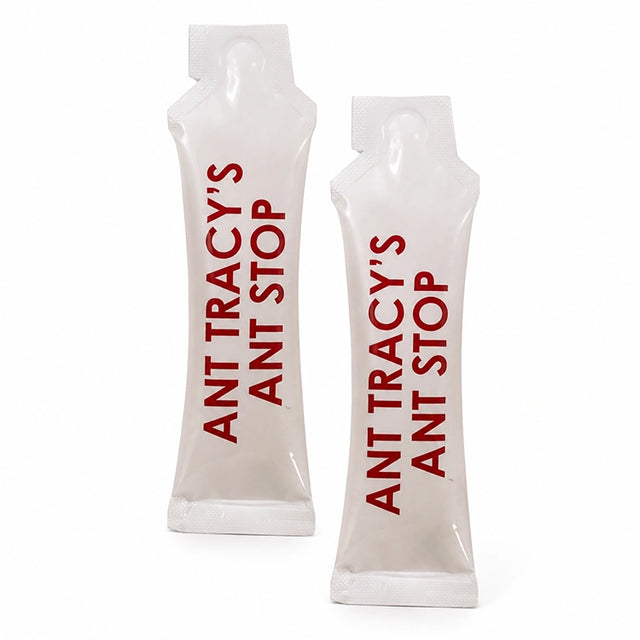 Two refill packets of Ant Tracy's Ant Stop ant barrier treatment standing upright on a white background.