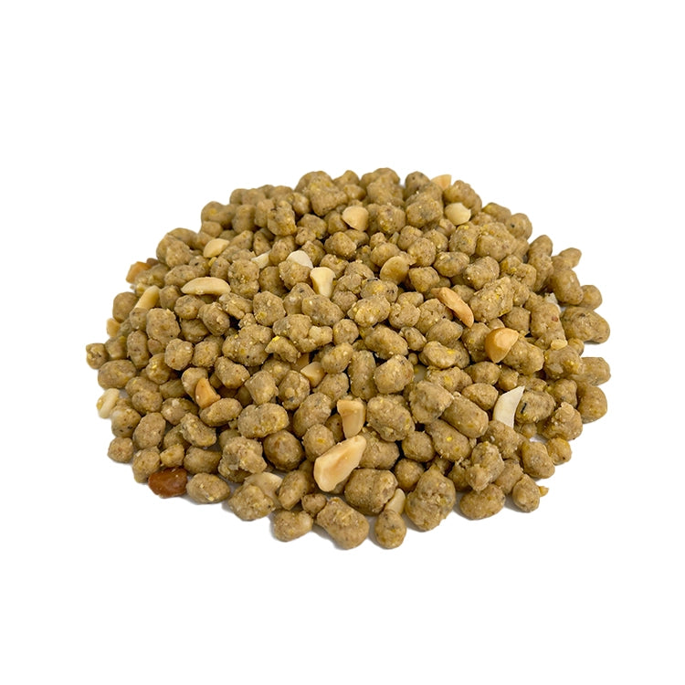 Energy Complete Blended Berry Suet Bites: Close-up of tan-brown pelleted bits with peanut pieces, offering high-energy, no-waste nutrition for birds.