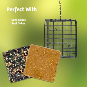 A square black metal hanging bird feeder shown with two seed cakes: one filled with mixed birdseed and one plain tan. White text on a green gradient background reads 'Perfect With Seed Cakes Suet Cakes.