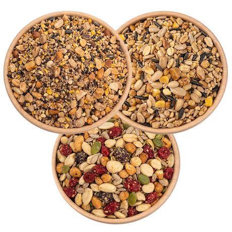 3 Bowls of birdseed from a birds eye view, specifically: Fancy Finch Mix, Super No-Waste Blend, and Woodpecker Blend