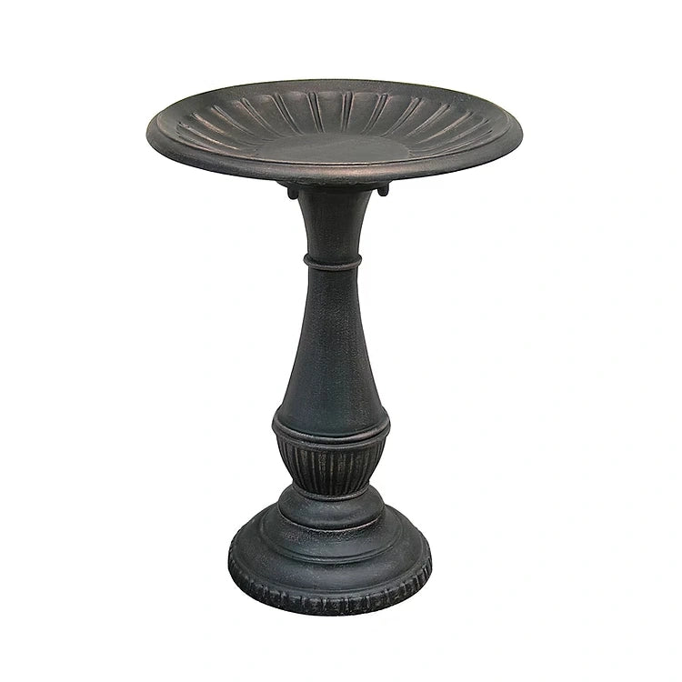 Metal pedestal bird bath on a white background