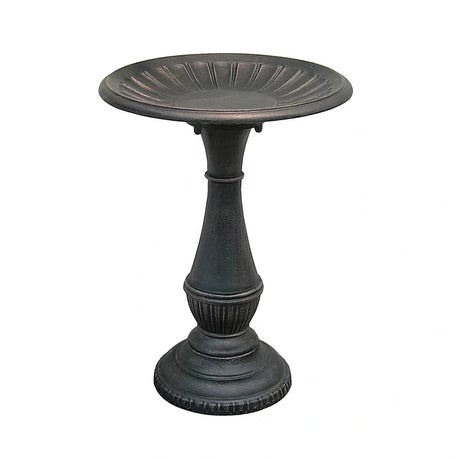 Metal pedestal bird bath on a white background