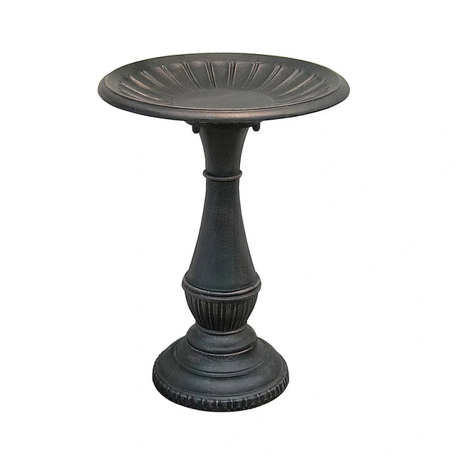 Metal pedestal bird bath on a white background