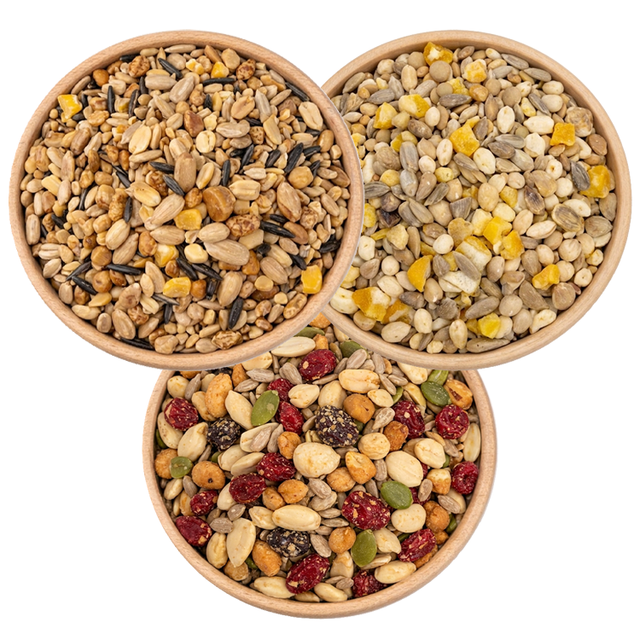 3 Bowls of birdseed from a birds eye view, specifically: Woodpecker Blend, Fancy Finch Mix, and Four Seasons No-Waste