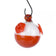 Bobber Glass Hummingbird Feeder: Close-up of a round glass feeder with three red flower ports designed to attract and nourish hummingbirds.