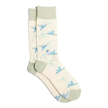 Cream hummingbird socks featuring blue hummingbirds in flight with sage green cuffs, heels and toes
