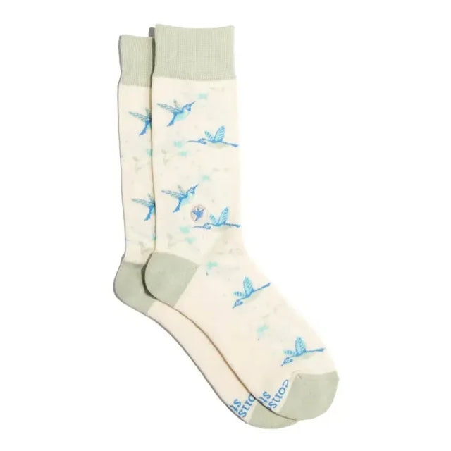 Cream hummingbird socks featuring blue hummingbirds in flight with sage green cuffs, heels and toes