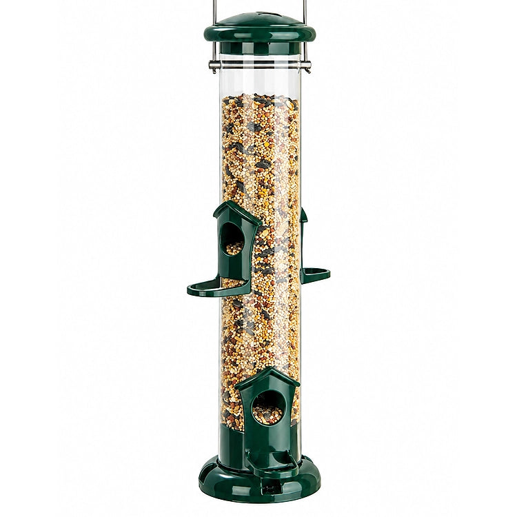 Green tube bird feeder with clear seed reservoir, two feeding stations with perches, and metal hanging handle, partially filled with mixed bird seed.