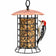 A cylindrical bird feeder with a copper-colored metal roof and a black wire cage body, shown on a white background with a red, black, and white woodpecker perched on the right side.