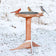 Western Red Cedar Heated Bird Bath with three songbirds perched on the rim, set in a snowy yard, showcasing its insulated design for winter use.