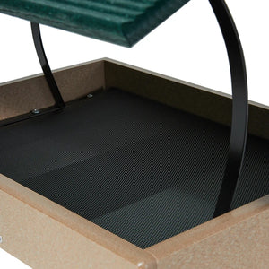 Close-up of a platform bird feeder with a mesh floor and metal frame.