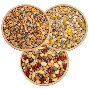 3 Bowls of birdseed from a birds eye view, specifically: Super No-Waste Blend, Woodpecker Blend, and Four Seasons No-Waste.