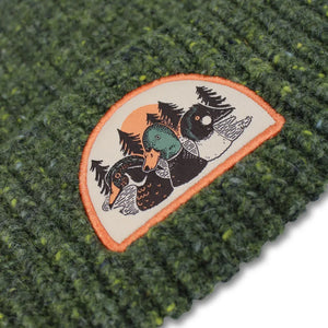 Duck Trio Wool Blend Beanie, Forest, features a dark-green chunky knit with an embroidered patch of three duck heads, a sun, and evergreen trees.